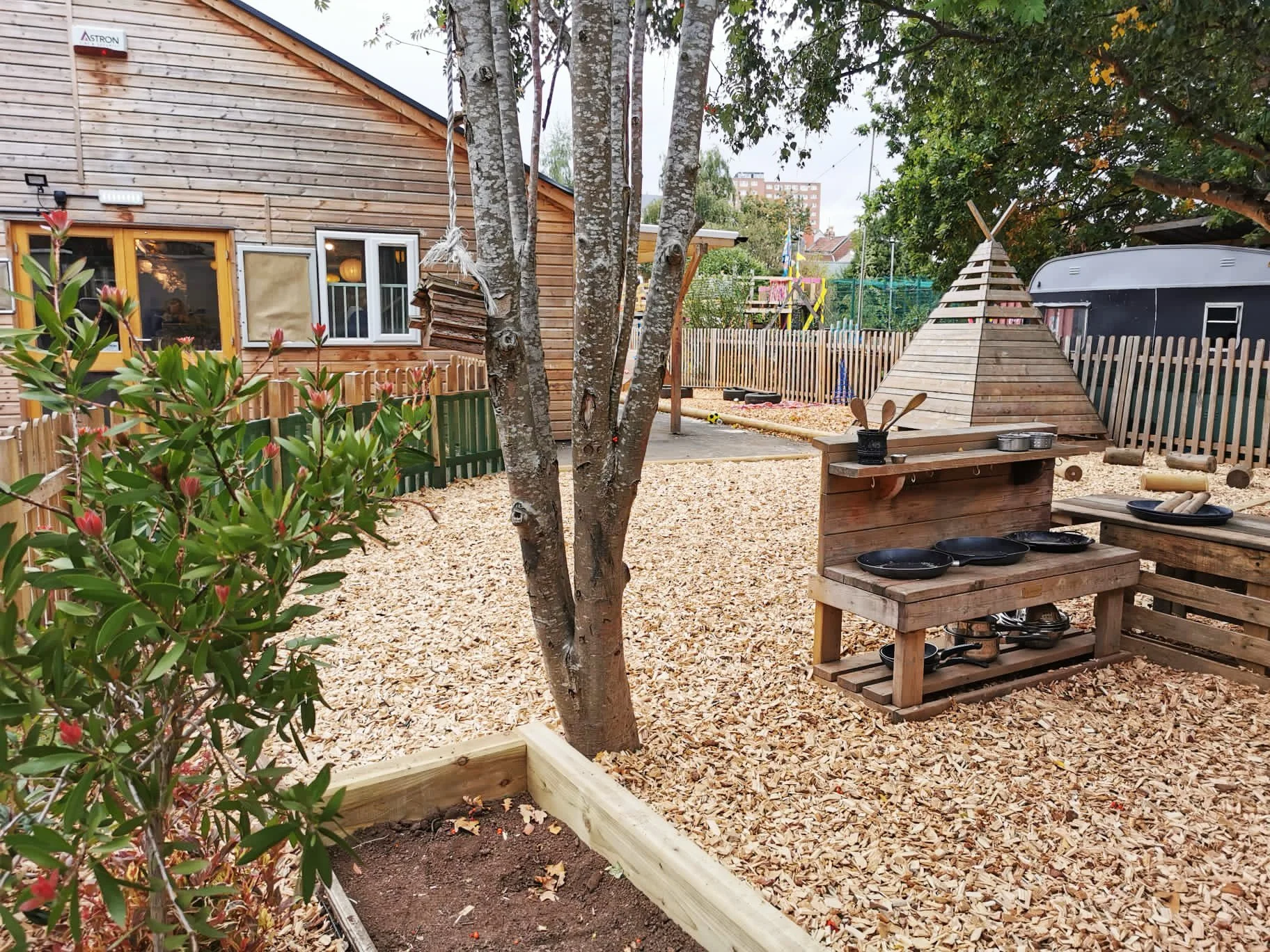 outside play area at Raised in Bristol nursery at Felix Road Adventure Playground