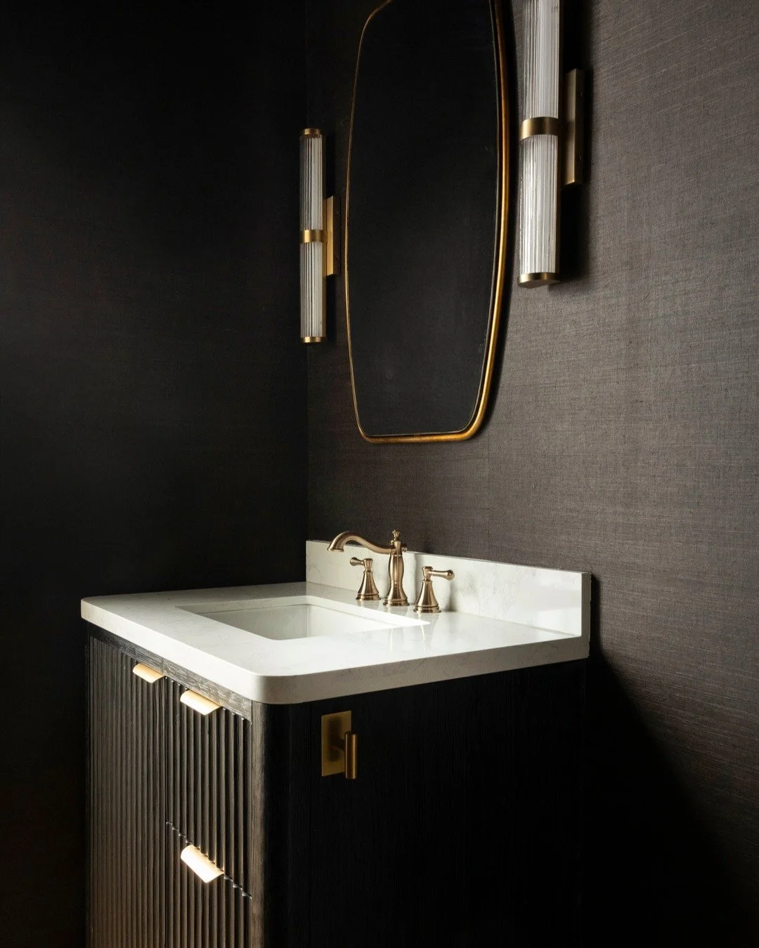 Yes&hellip; we really did remove the garage door from the powder bath. 😂 (because nothing says &ldquo;welcome&rdquo; like parking access from your loo, right?)

Now this small space makes a big statement&mdash;dark, dramatic tones layered with textu