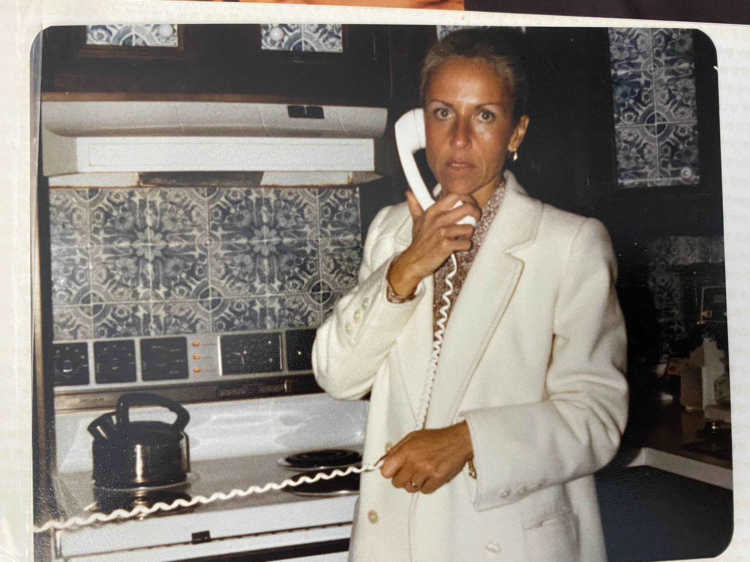 Talking on the phone doing business with Susan Tose Spencer