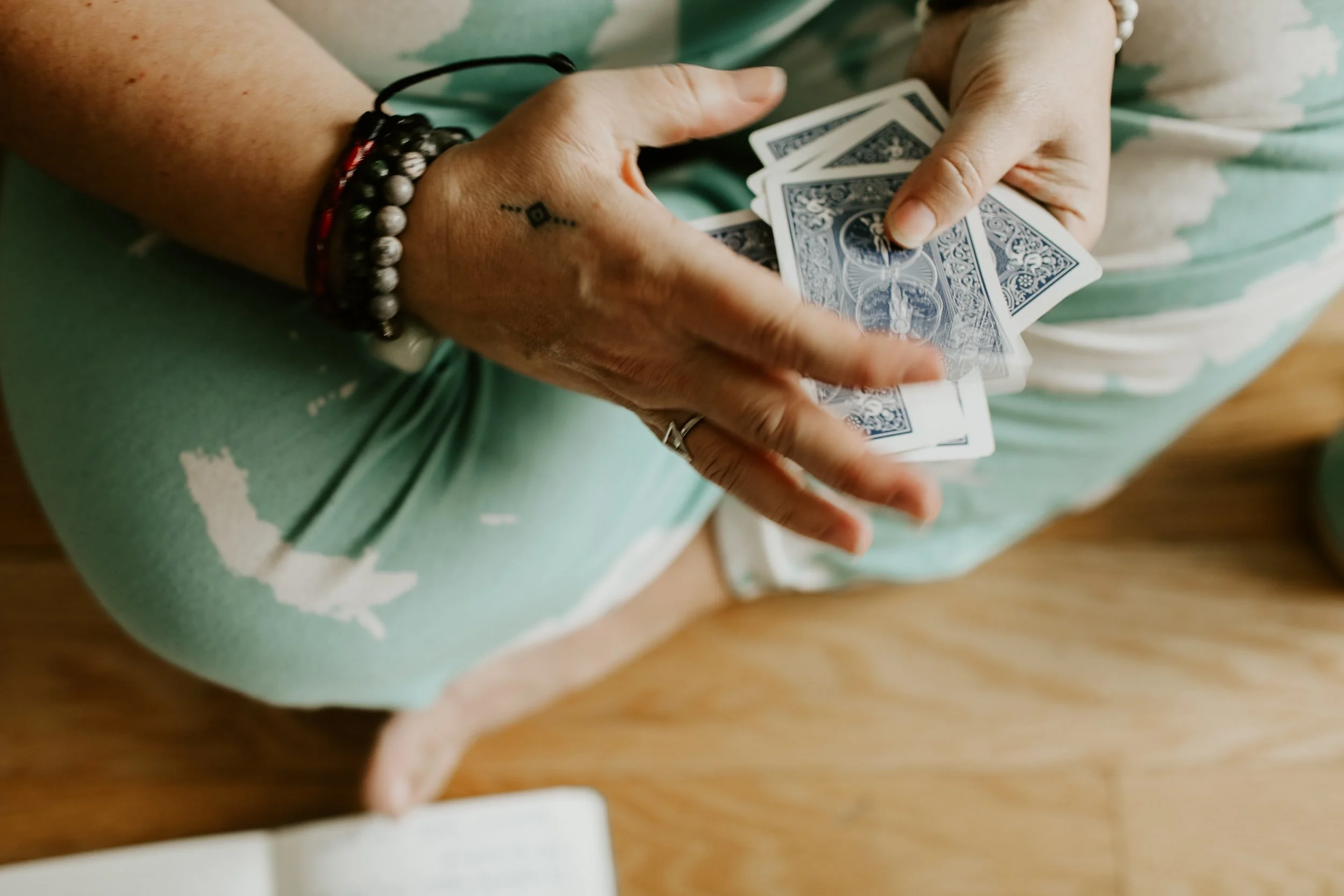 Intuitive Numerologist playing with a spread for a client reading 