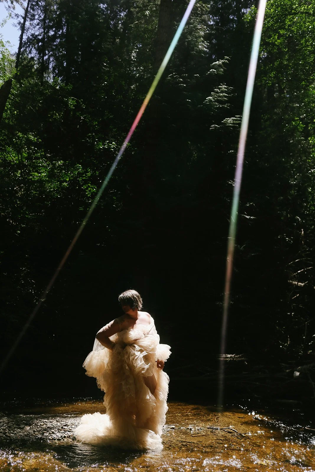 Woman fully embodied in her divine essence standing in the sun rays