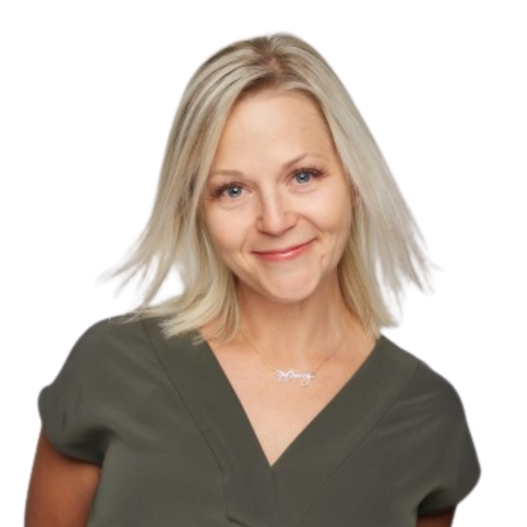 A smiling blonde woman with blue eyes wearing a dark green V-neck shirt and a silver necklace.