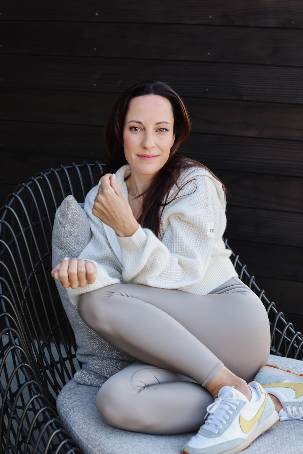 Jessica Long sitting in chair smiling at camera