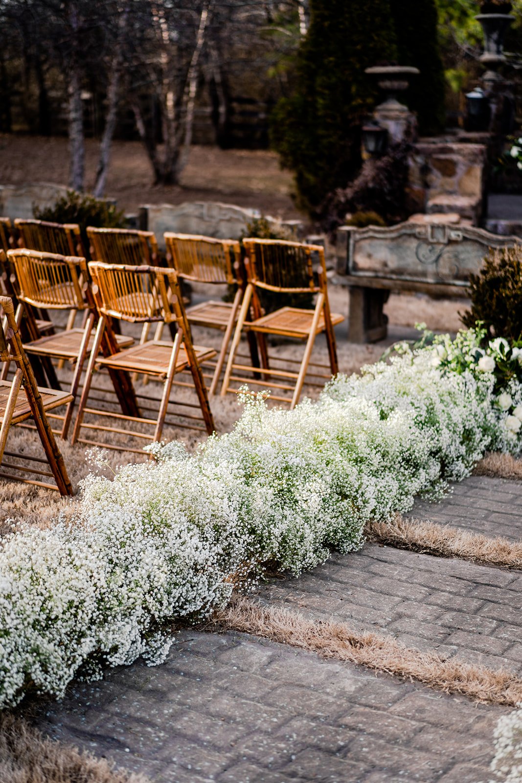 luscious babies breath floral aisle runner at outdoor wedding in Arkansas