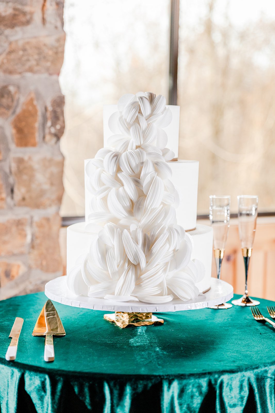 chic all white wedding cake with 3D details