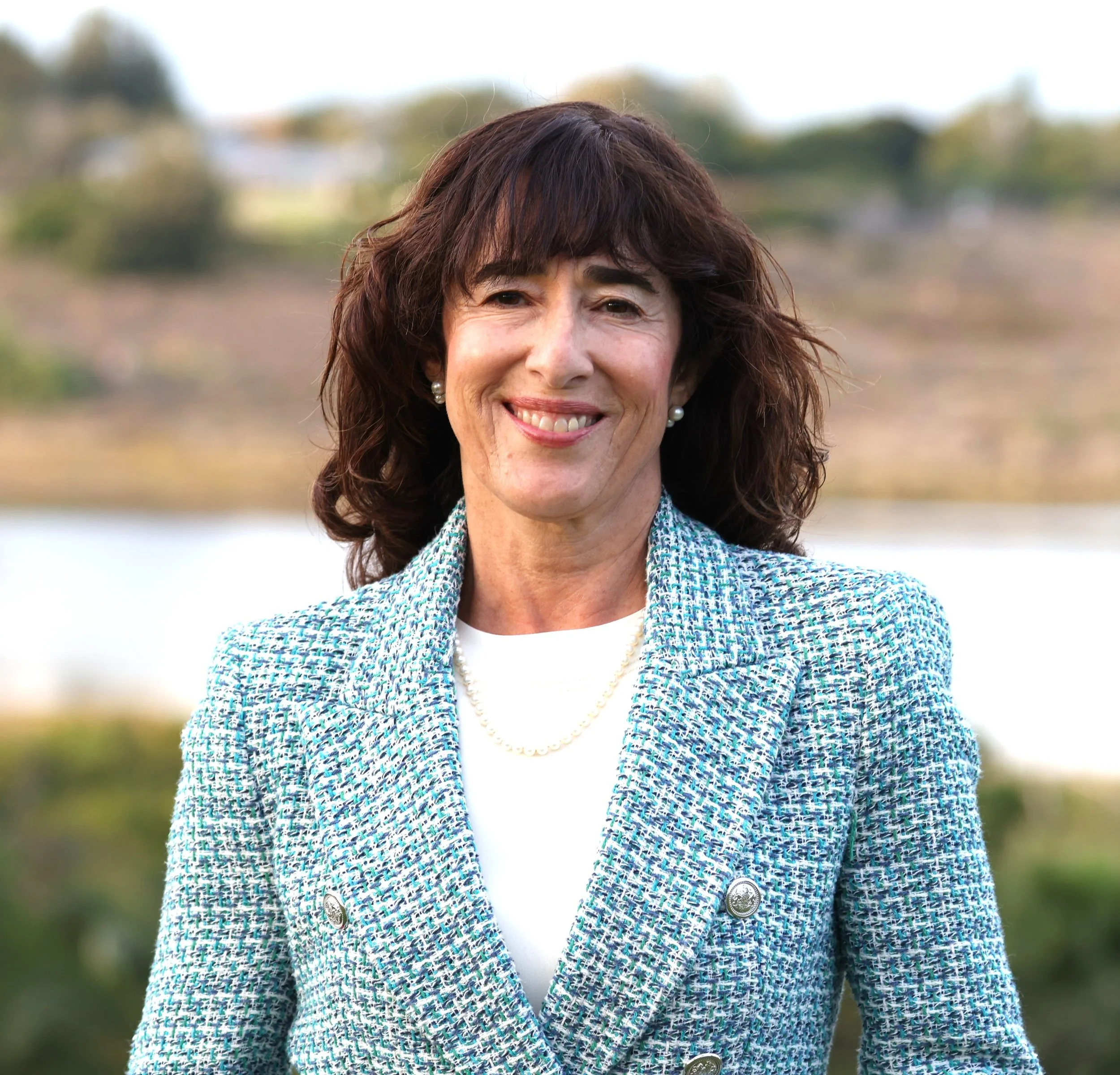 CAROL CRANE HEAD SHOT education column blue.JPG