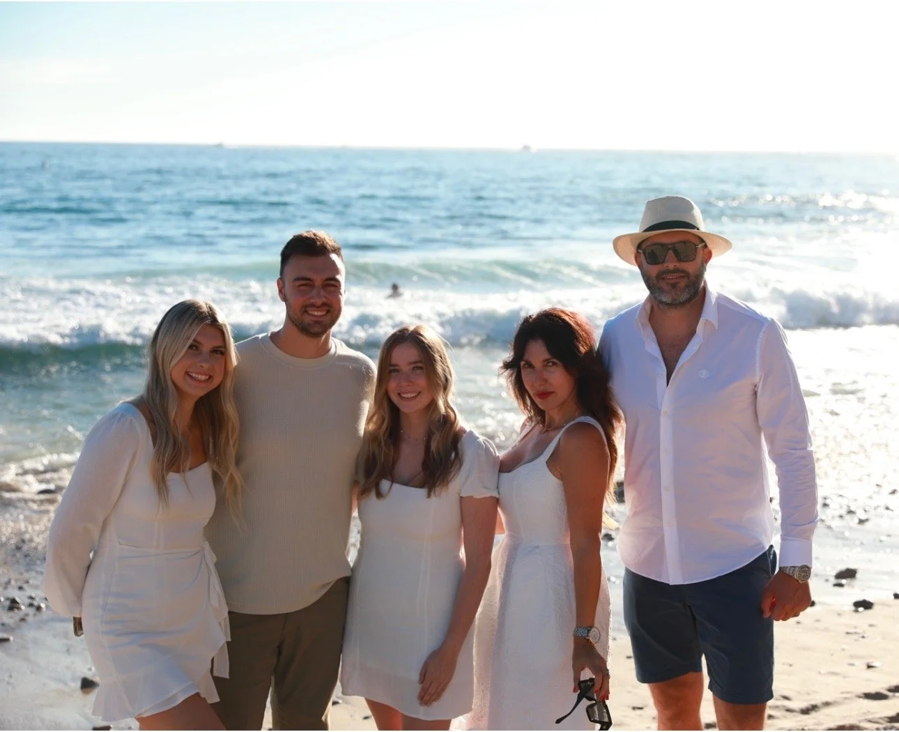 NATASHA ALEX AND FAMILY AT THE BEACH.jpeg