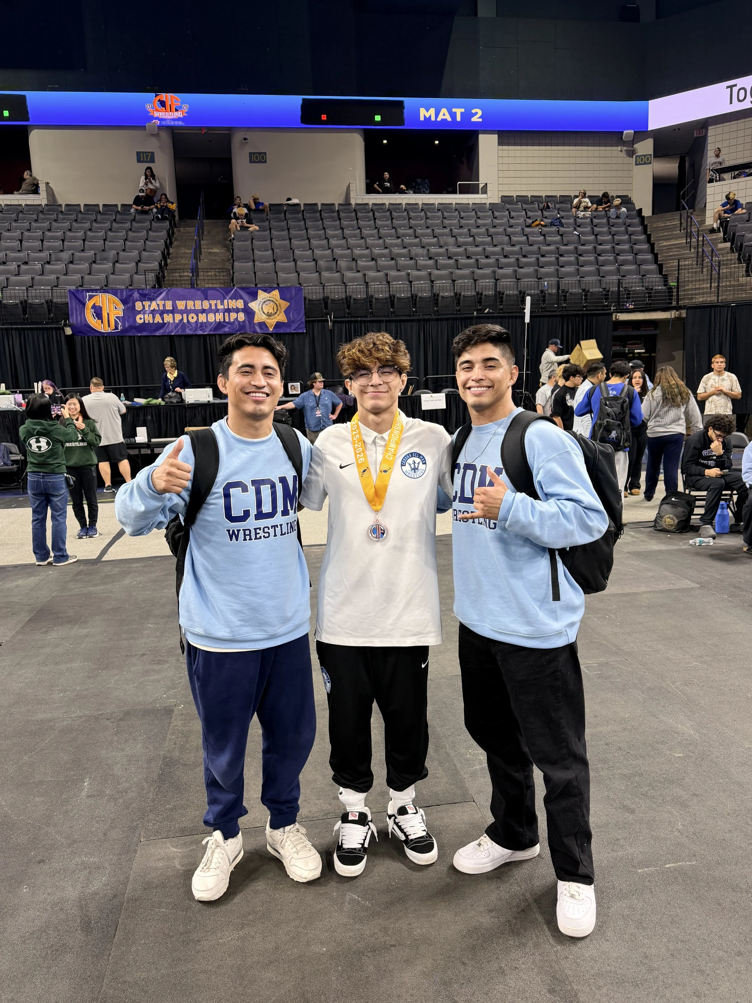 AARON SILVA AND HIS COACHES BROTHERS.jpeg