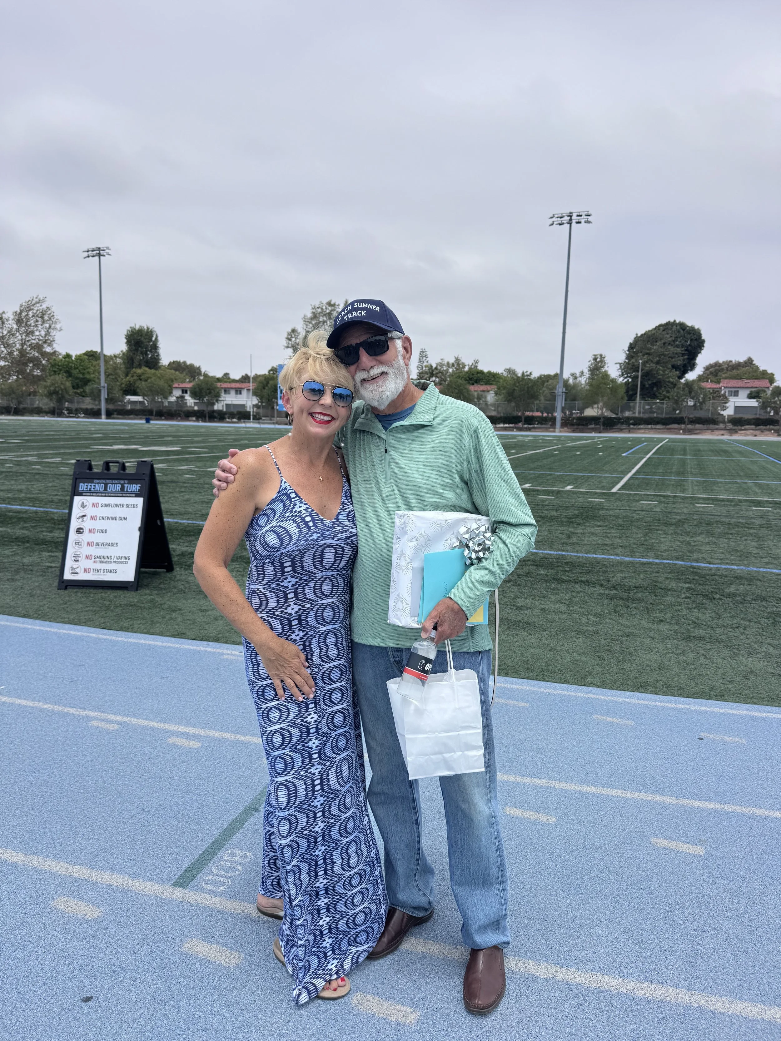 COACH AND JULIE MEANS RETIREMENT PARTY 2026.jpeg