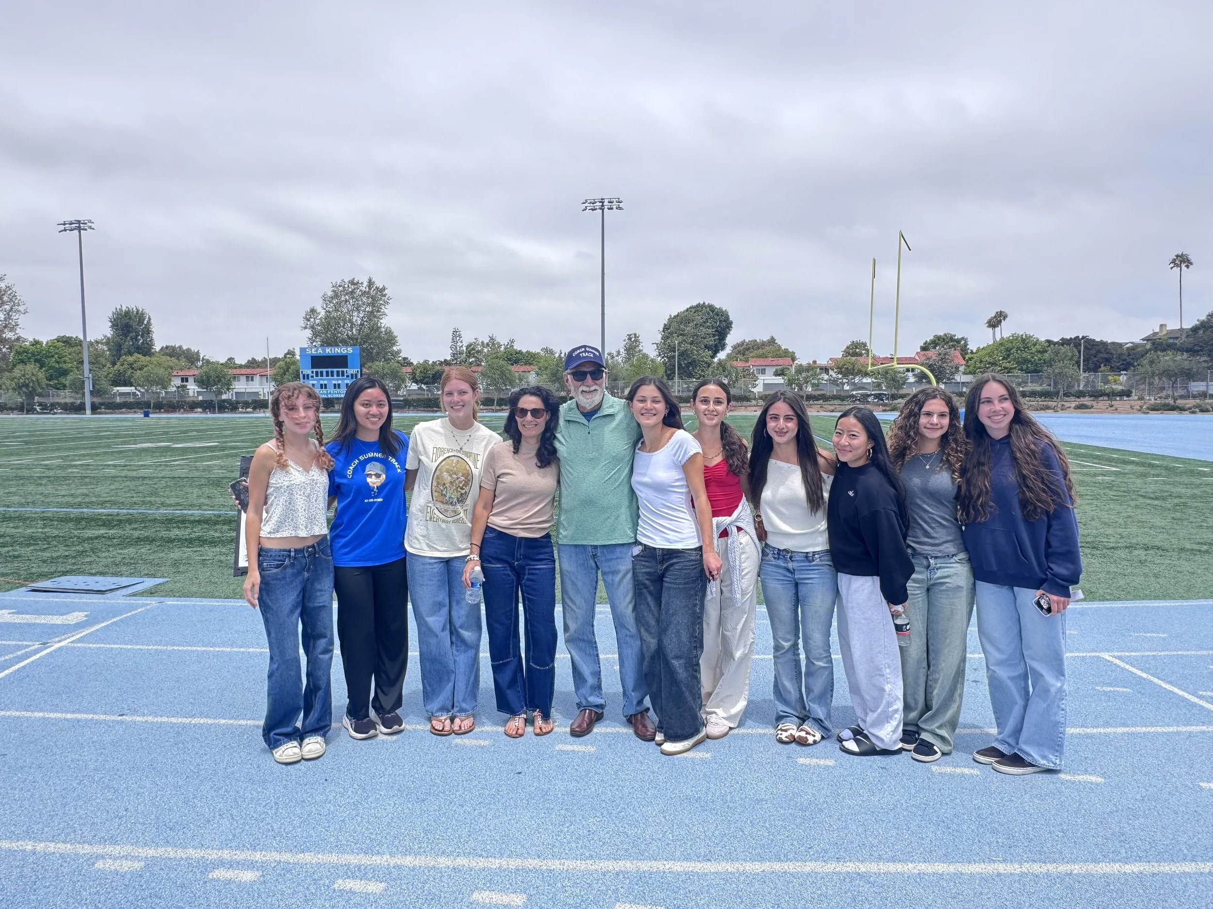 COACH AND THE GIRLS.jpeg