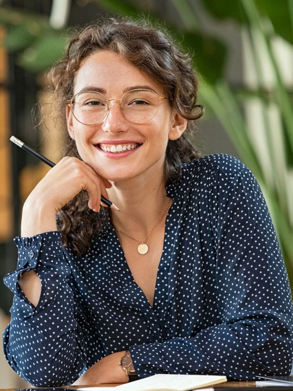 Smiling professional woman at her desk