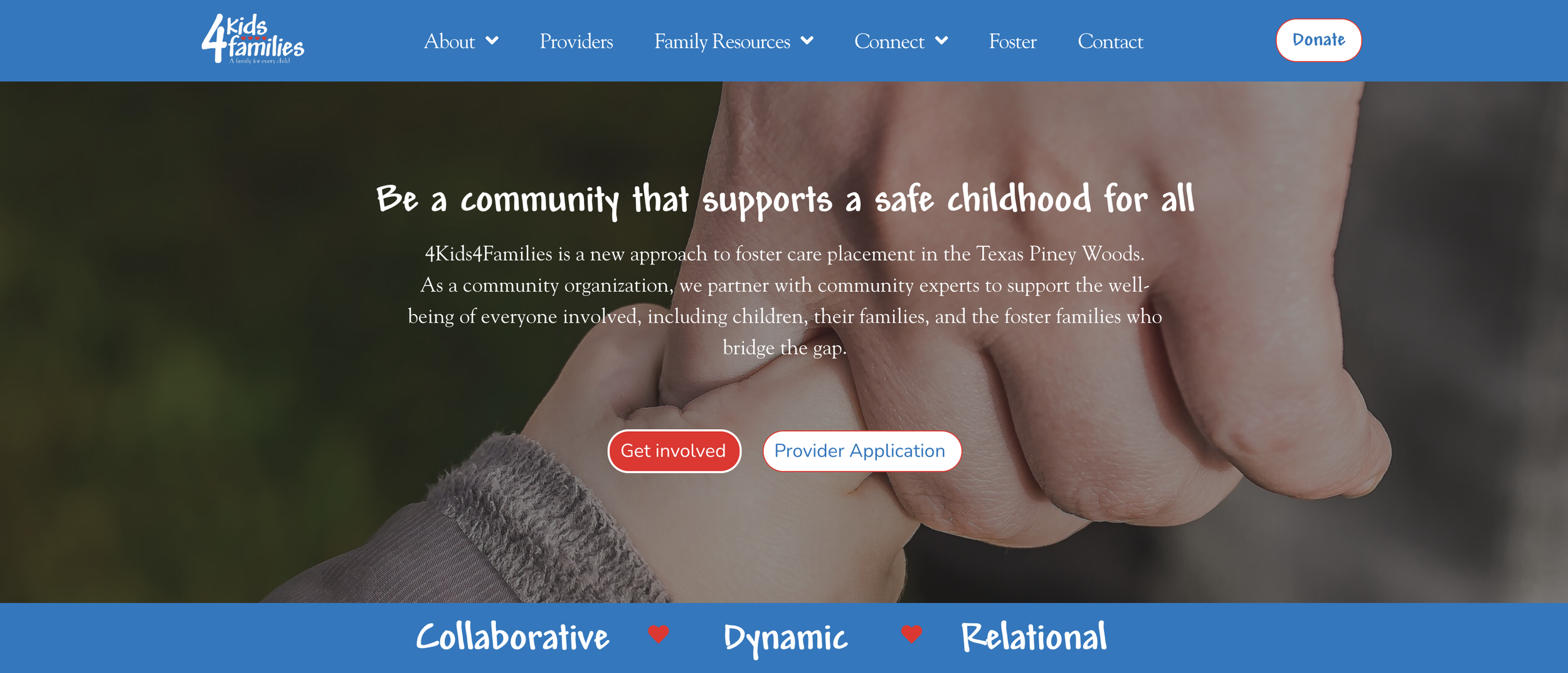 Close-up of two hands holding each other, one adult and one child, on a blurred outdoor background.