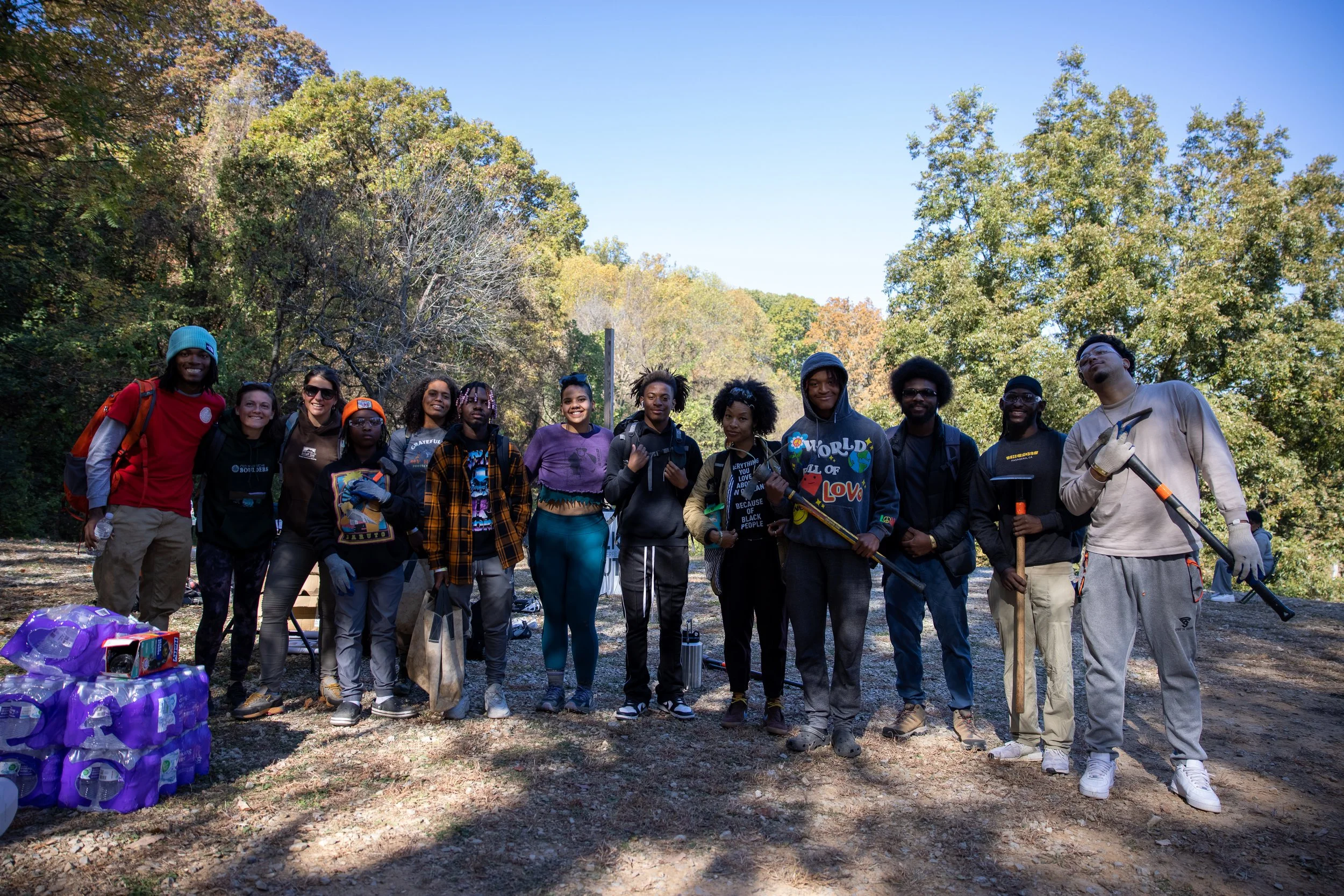 A group of Black climbers posing in a campground.