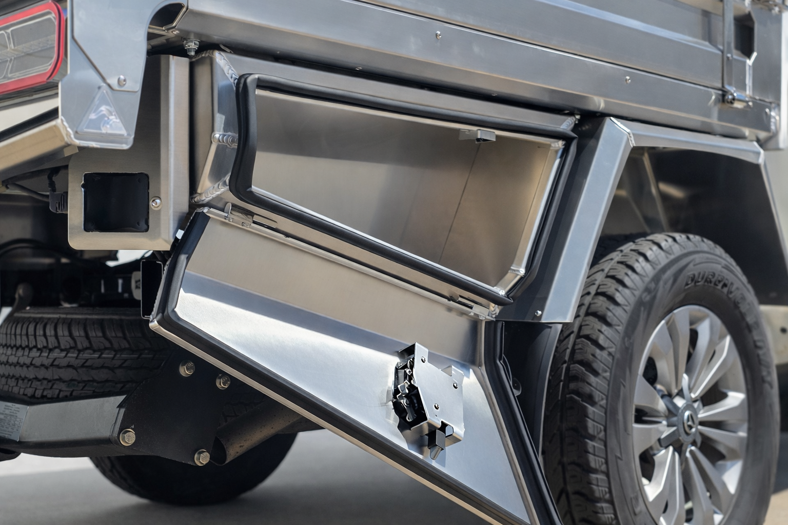 Undertray storage box with vehicle details.png