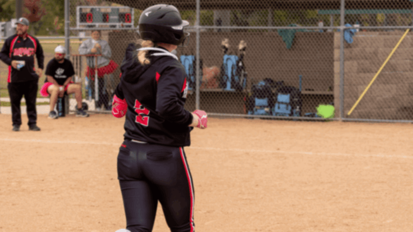 Softball team celebrates player's homerun