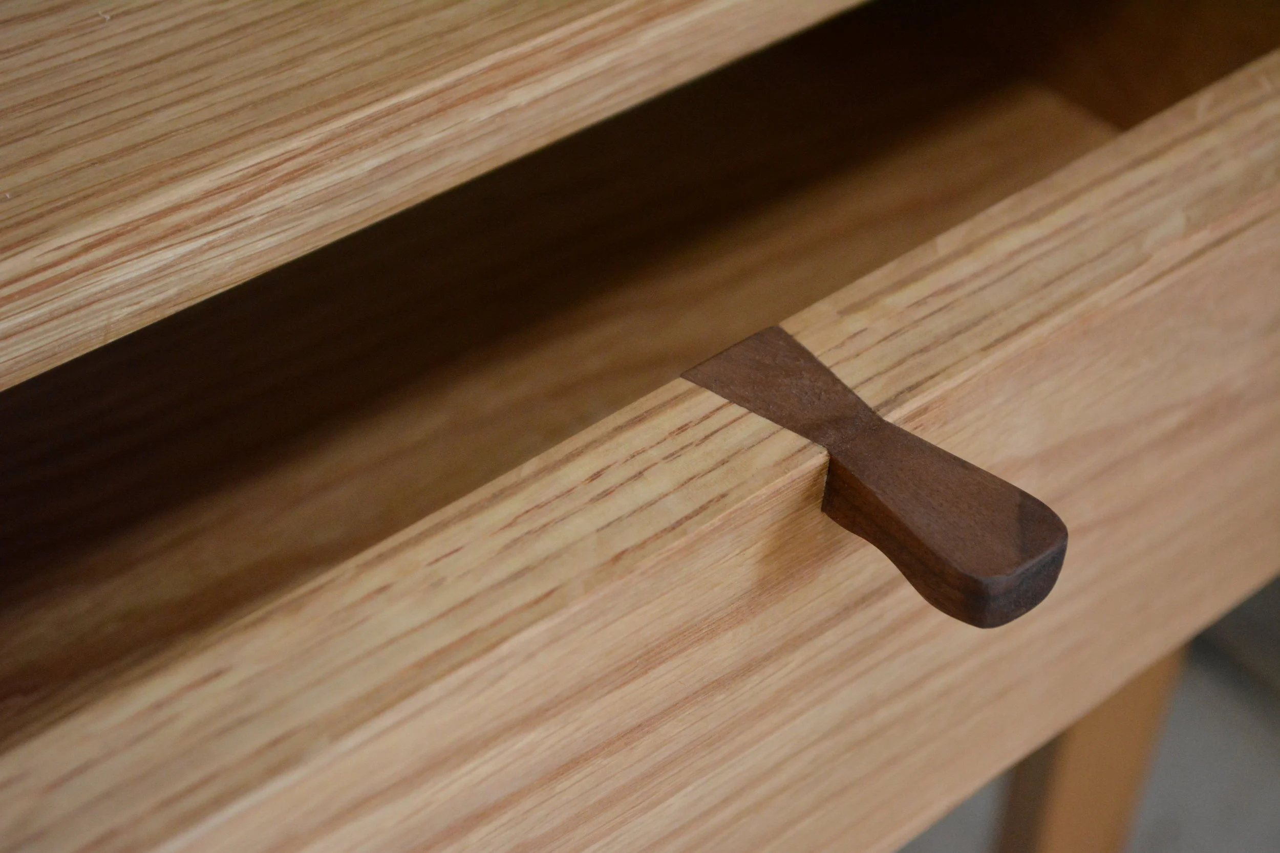 Takumi Woodwork - Walnut Drawer Pull of an Oak Console Unit