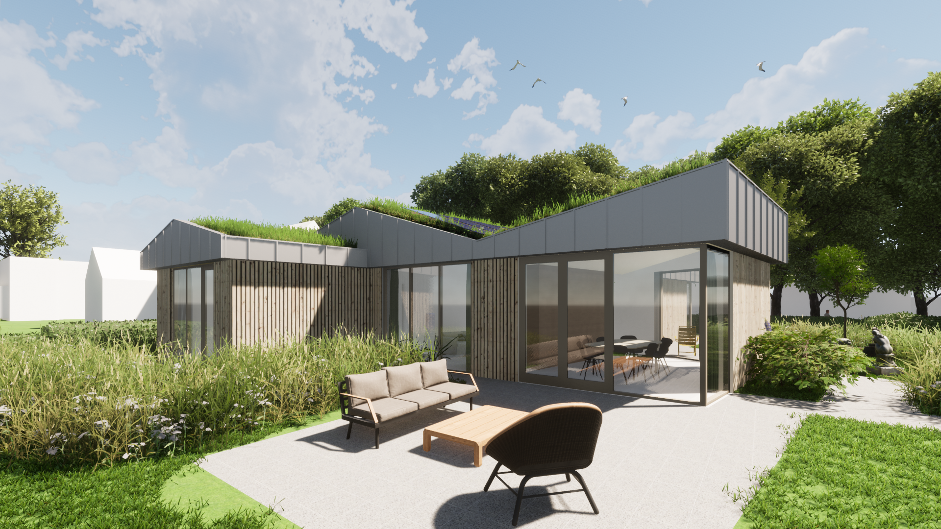 het terras aan de achterzijde grens direct aan de "tuinkamer", een ruimte waar de eettafel staat en waar je alle kanten op de tuin inkijkt.