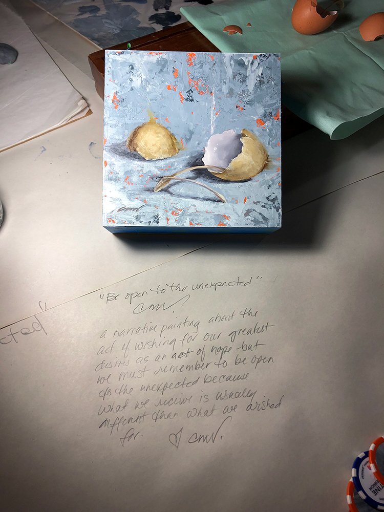 Painting of two egg shells with a wishbone, on a textured blue and orange background.