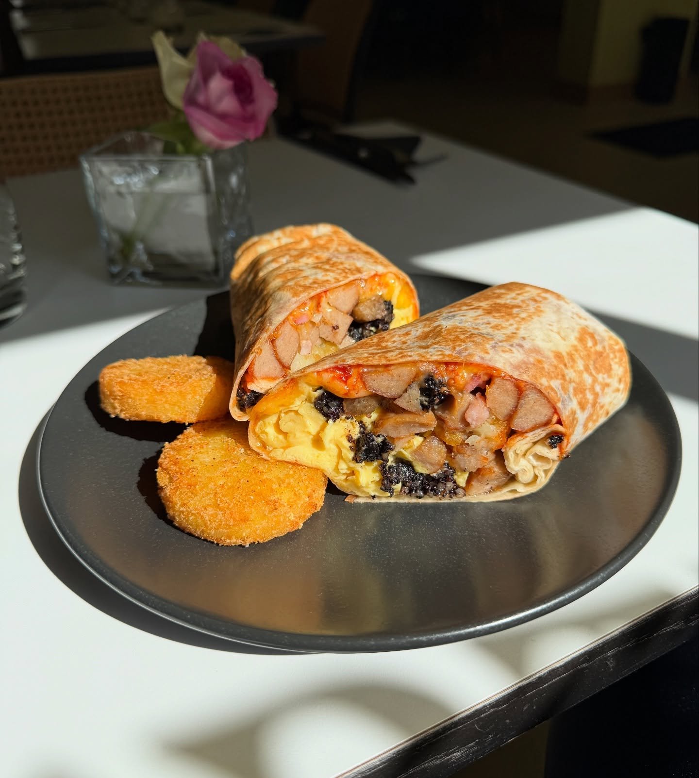 Breakfast burrito 🌯 sausage bacon puddings scrambled eggs hash browns relish + cheese in a flour tortilla 💕💕