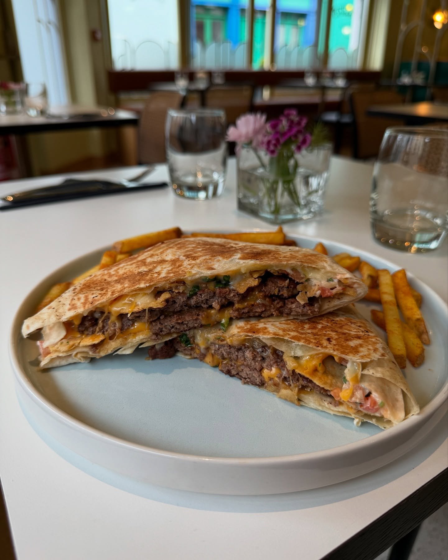 🌮 🔔 crunch wrap - @mjoneillbutchers beef, cheese, sour cream, hot sauce, pico, crunchy tortillas wrapped in a flour tortilla and pressed (no lettuce but is hot lettuce weird?)