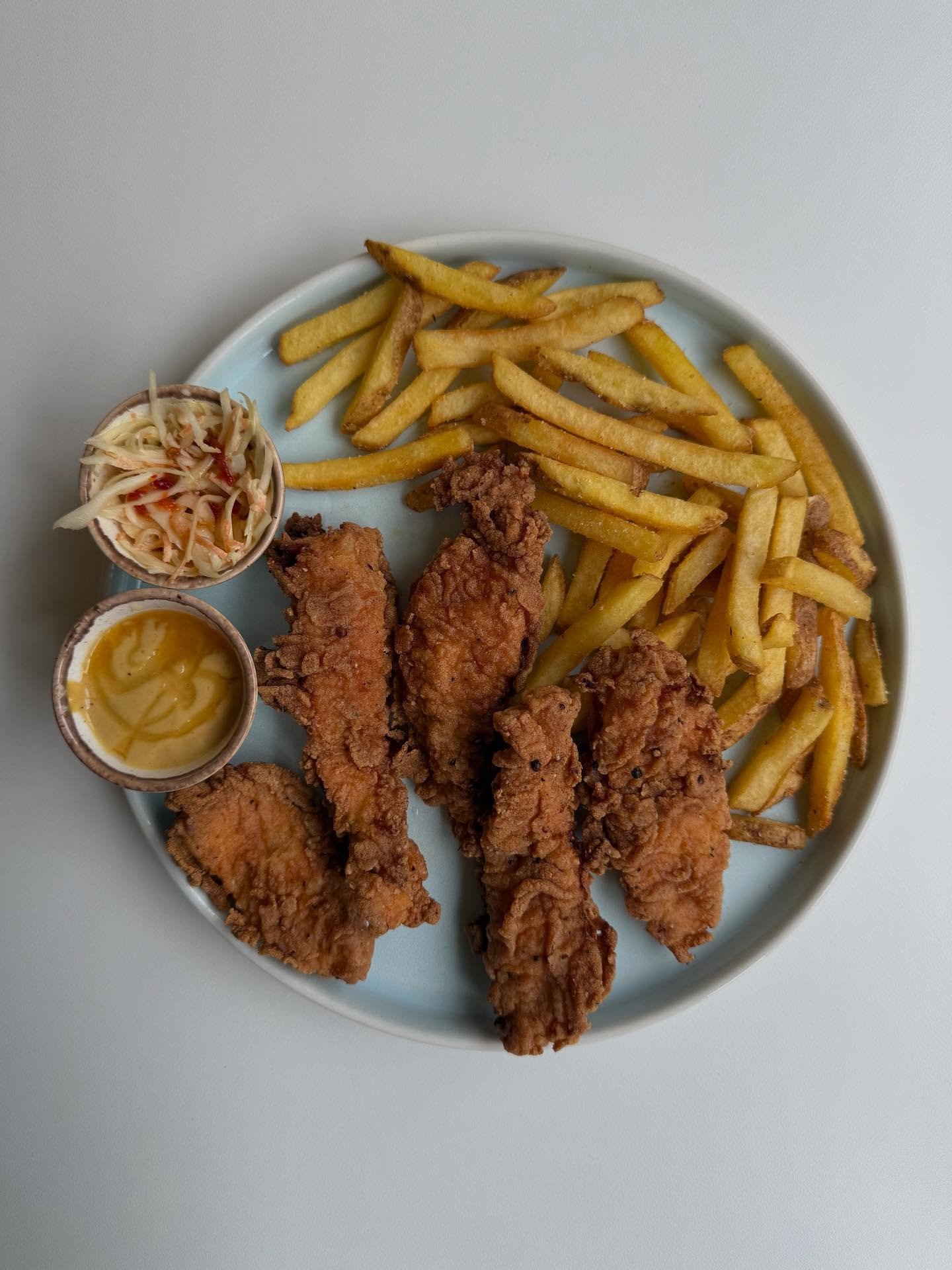 Chicken tenders with fries, coleslaw and hot honey mustard mayo 🤩 💗 🍗 🍟