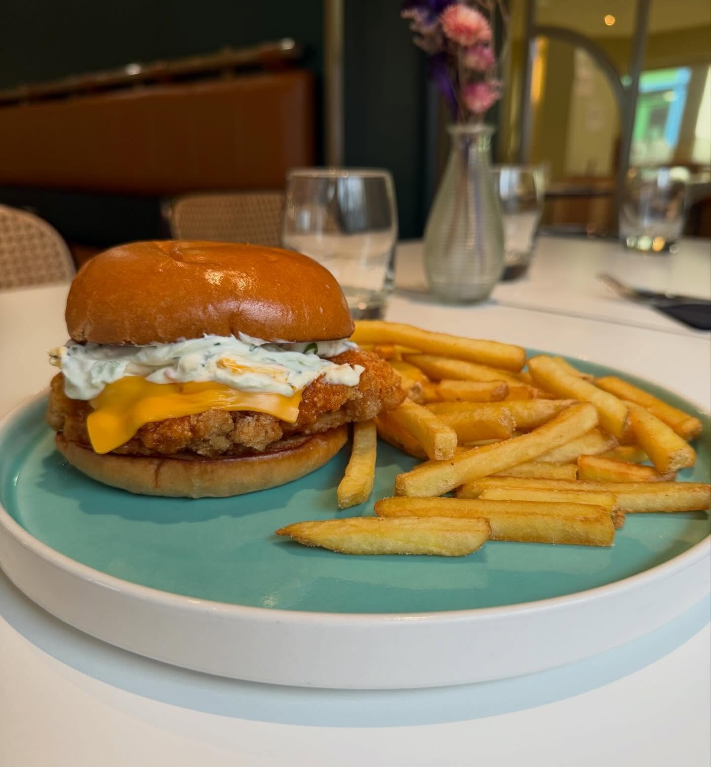 Buffalo Chicken Burger - crispy fried chicken breast, blue cheese schmear, Franks Red honey butter, american cheese on a brioche bun with fries 🍟 🍔 🍗