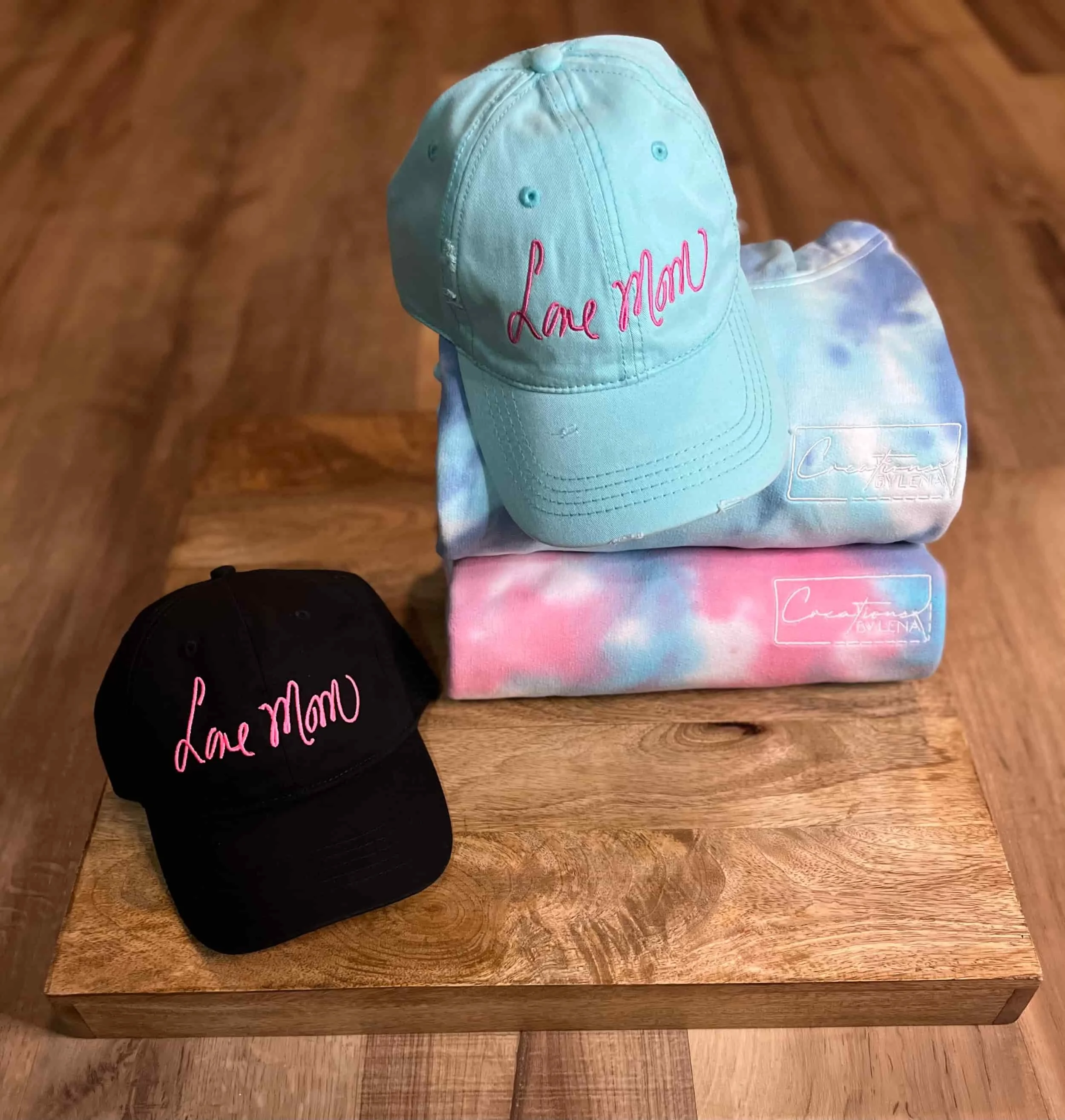 A photo of items from the Love Mom collection of apparel by Creations by Lena