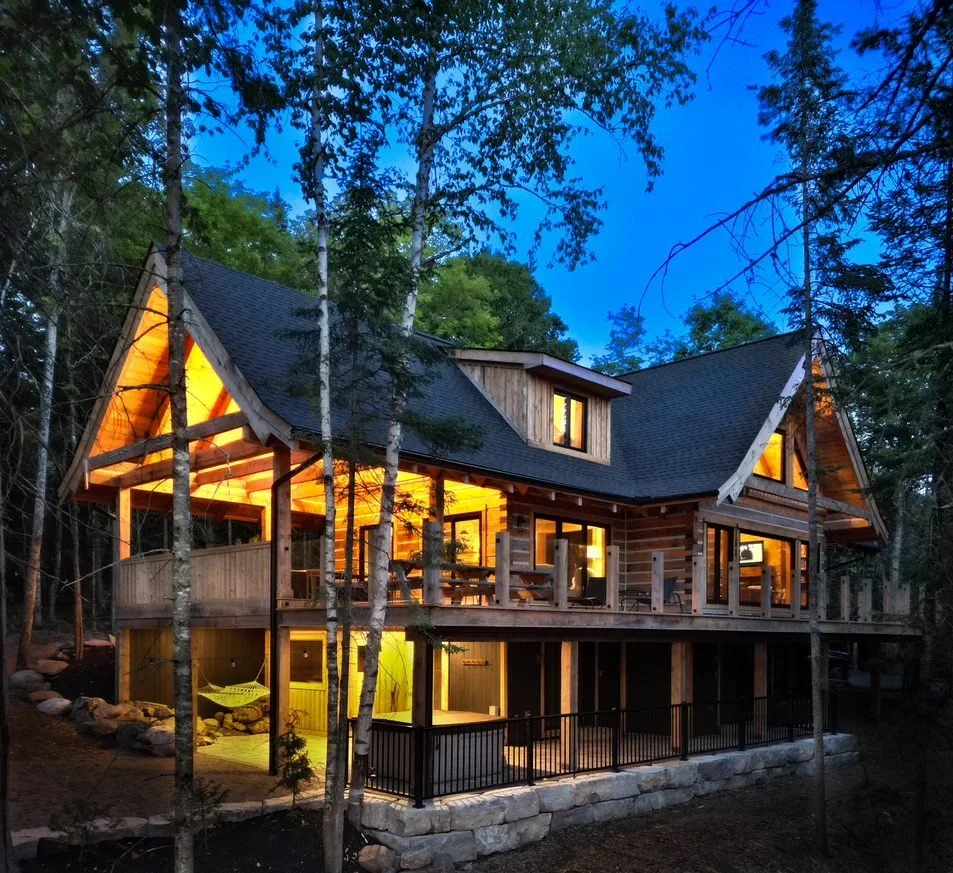 Log House in the Forest at Night.webp