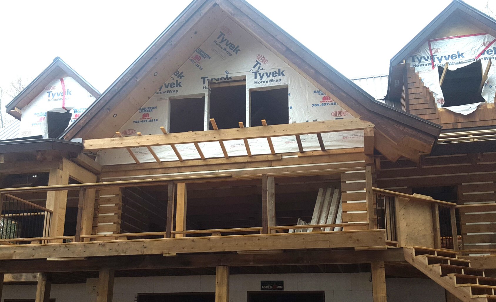EcoLog build two dormers with wing and porch-min.jpg