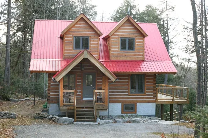 Log House with Red Roof and Dormers.webp