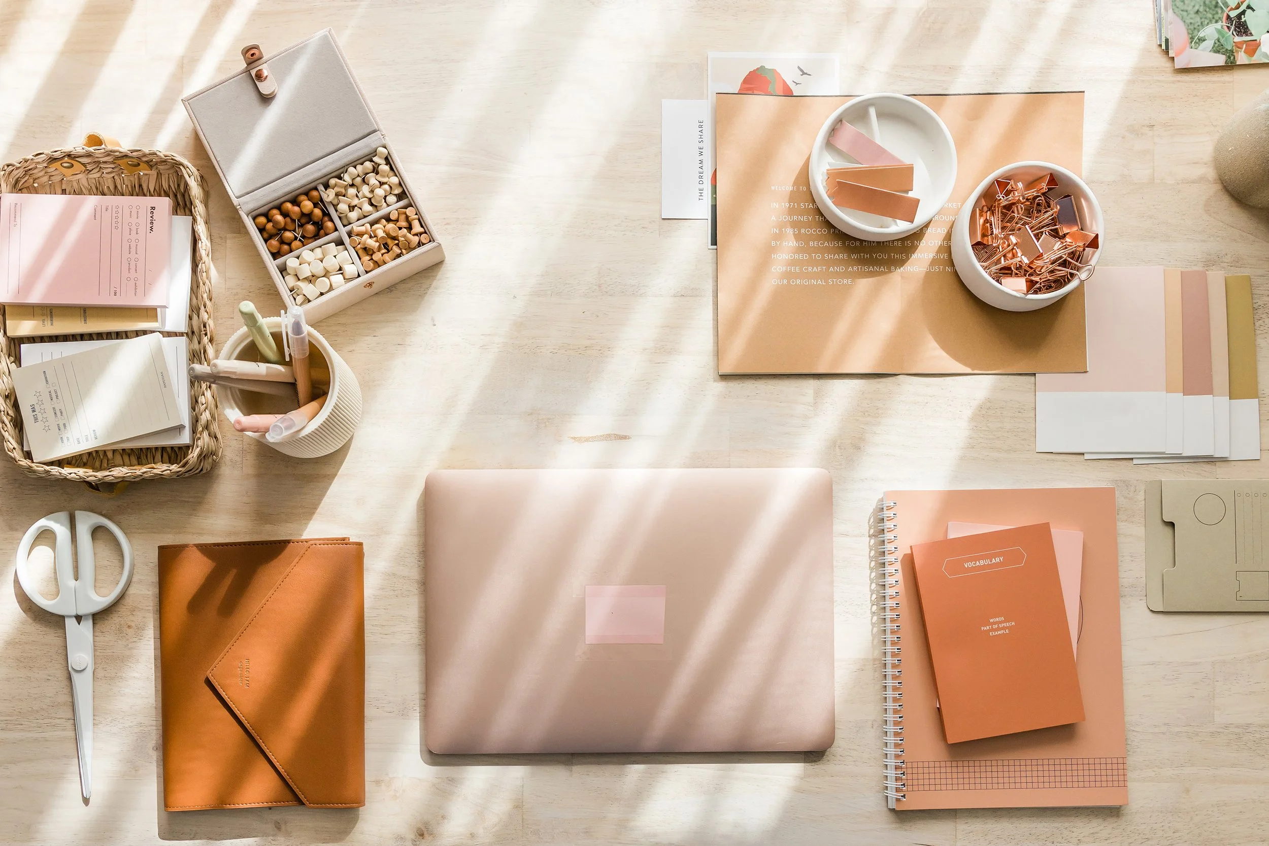 A pic of a mac on a desk with office supplies to illustrate bts work of Ellie Miller Design Co. who created squarespace templates and web design for therapists and coaches