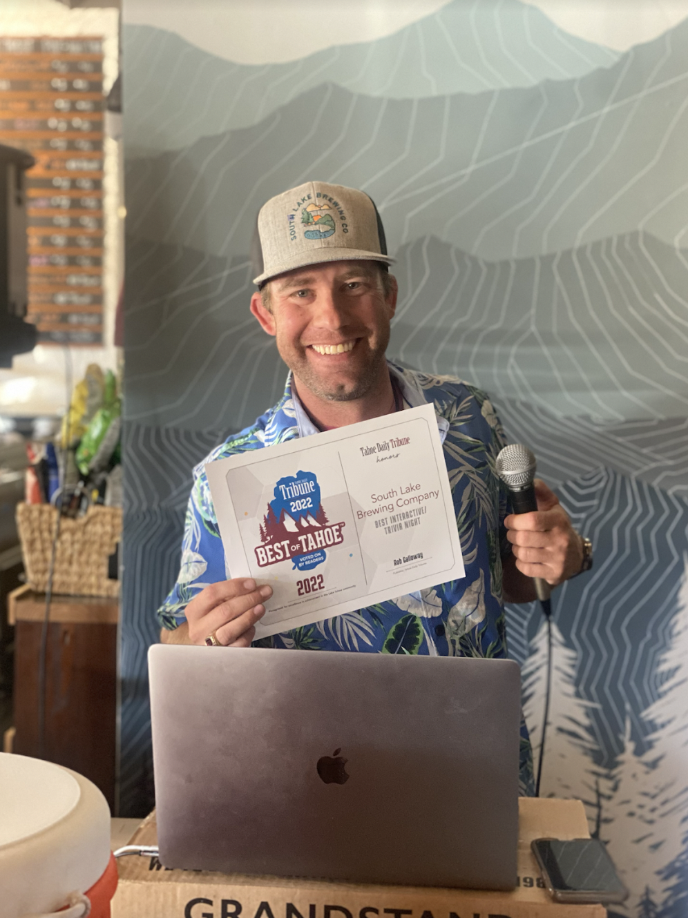 Trivia Host Morgan smiling with award