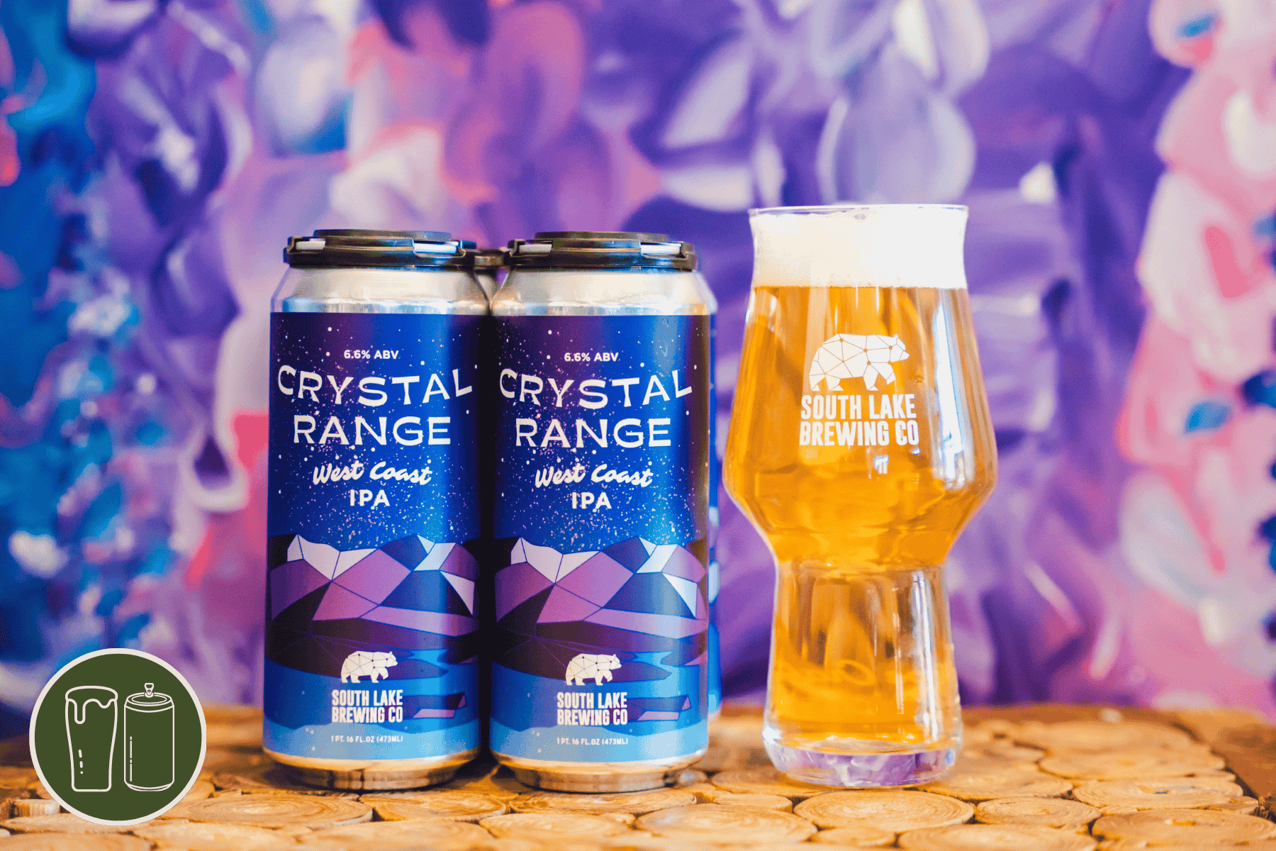 Four pack and pint of crystal range ipa in front of a mural of flowers