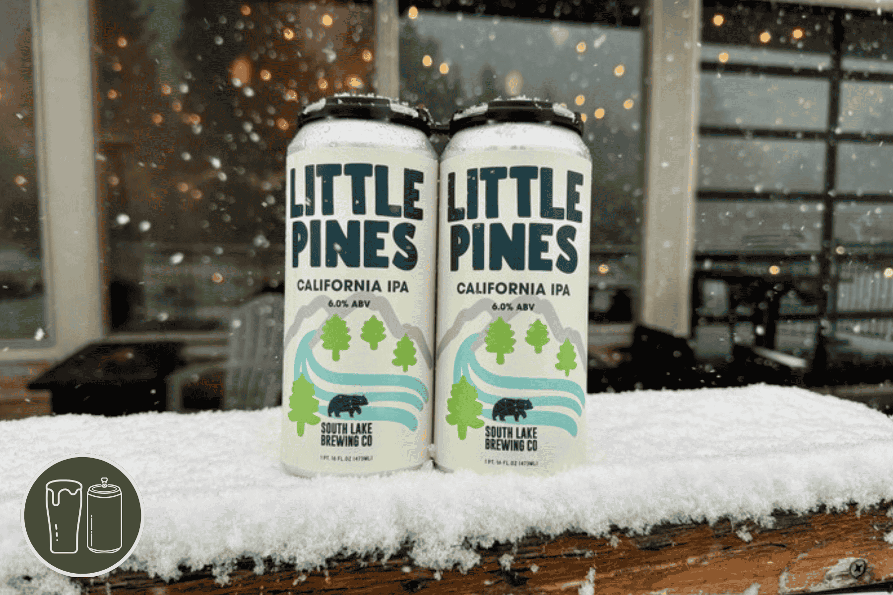 Four pack of little pines on a snowy railing in front of the brewery
