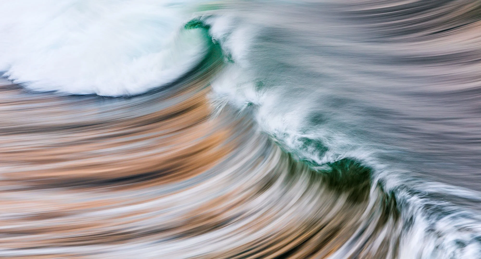 Blurry image of ocean waves crashing.