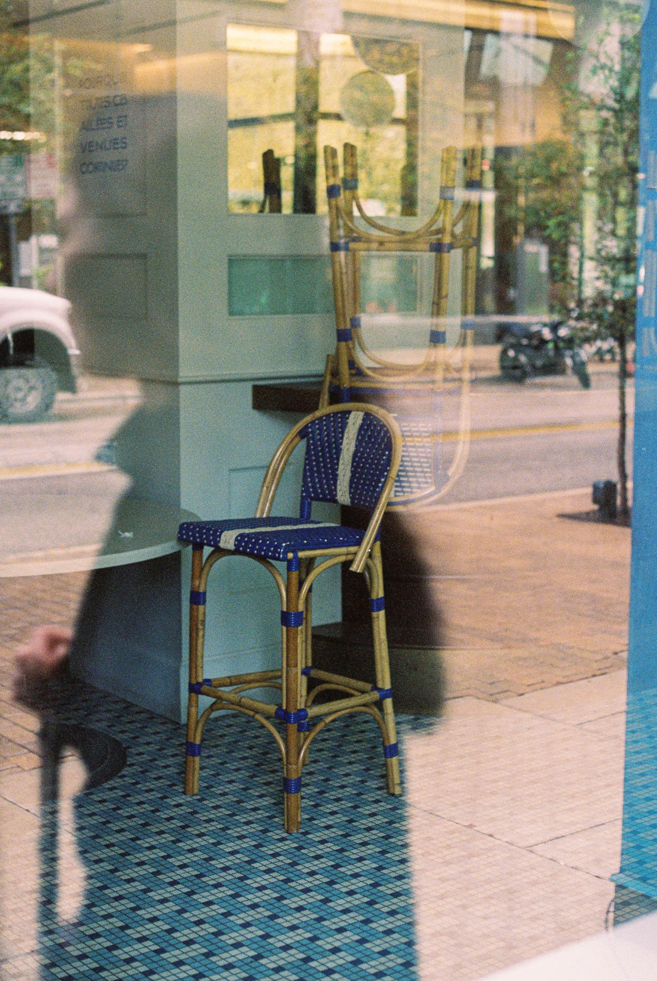 Aimee-Anderson-Window-Reflections-with-Stacked-Blue-Chairs-in-Downtown-Austin-on-Film-1.jpg