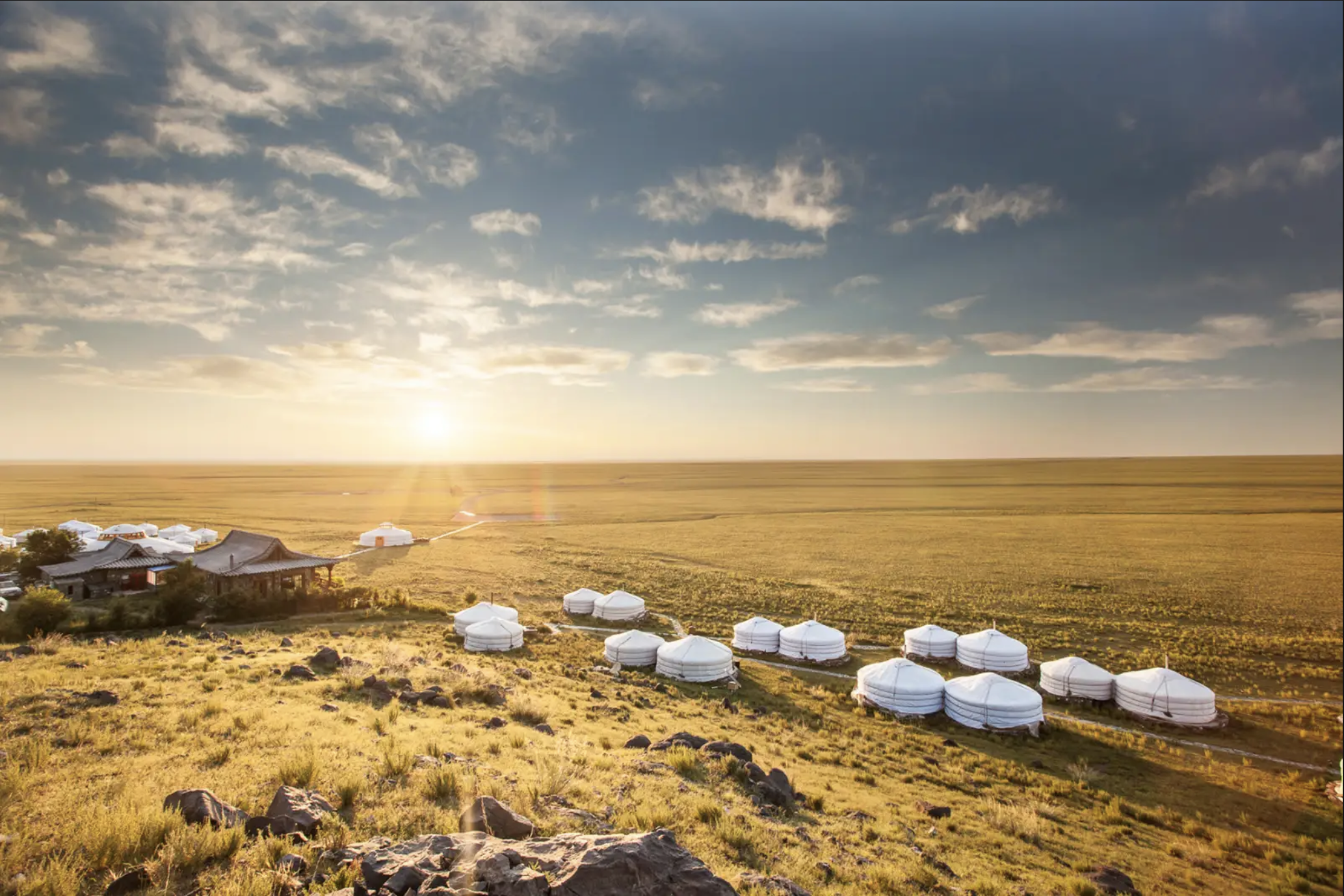 Sun glistening over the camp of traditional gers. Courtesy of Three Camel Lodge.