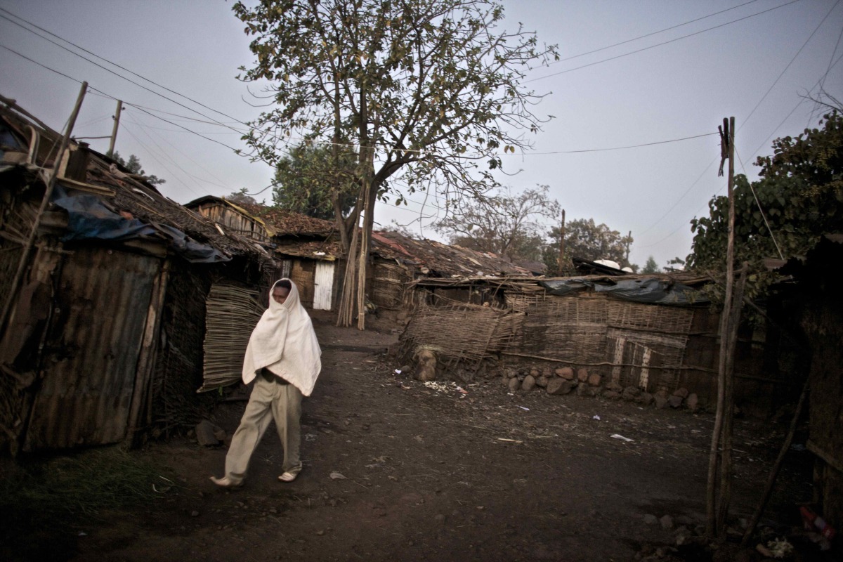  A man walks through the neighborhood of Bahir Dar where commercial sex workers wait for clients night and day, in the Northern Amhara region of Ethiopia. 