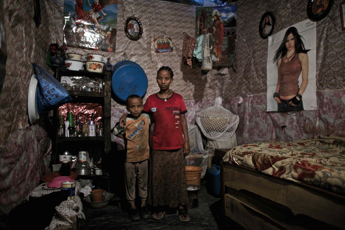  Fit Fit, 25 years old, and her son Letmegaeta, 11 years old, portrayed in the shack where they live and where Fit Fit works as a commercial sex worker in the city of Bahir Dar. Fit Fit escaped from her husband to whom she was sold into marriage at t