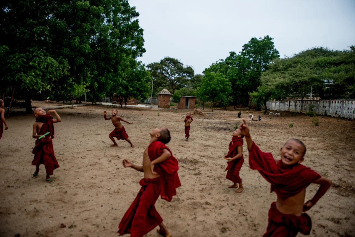  Novice monks play with new toys at a small monastery in Bagan. 