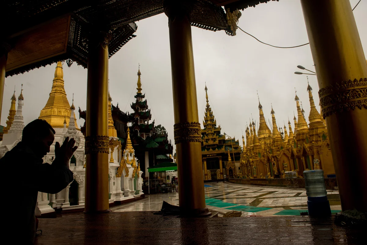  Man prays at Shwedagon Pagoda Yangon (Great Dragon Pagoda). 