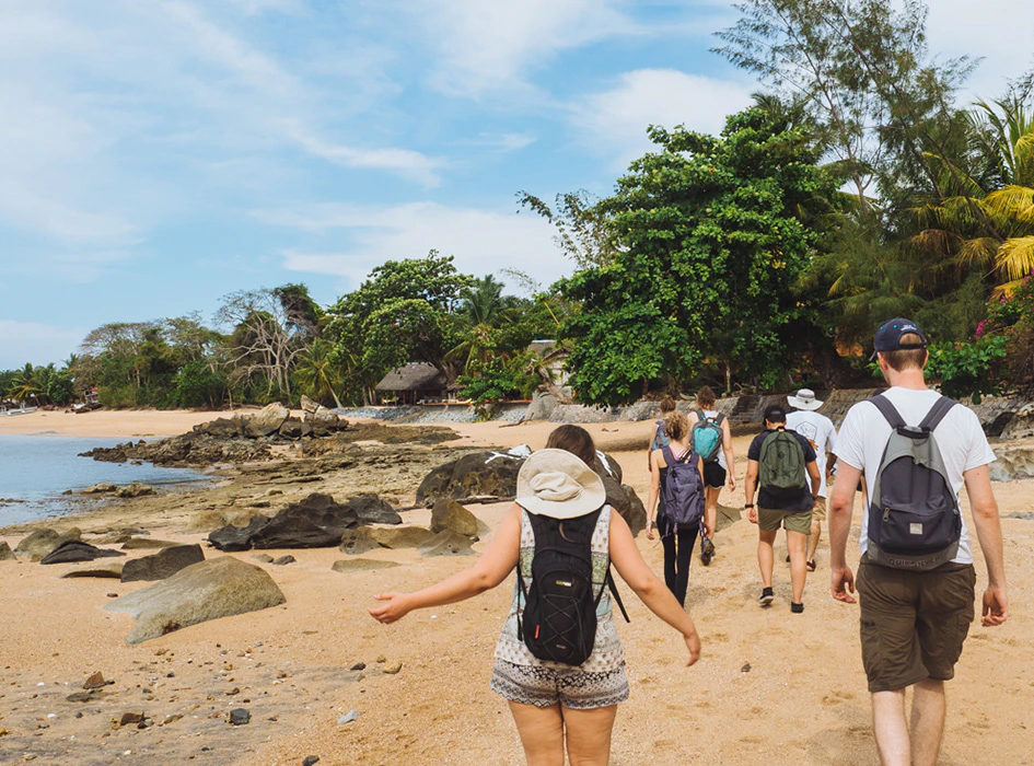 people walking on a beach