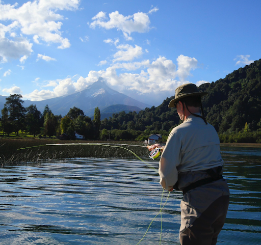 Person fishing in a lake in Chile, 2012