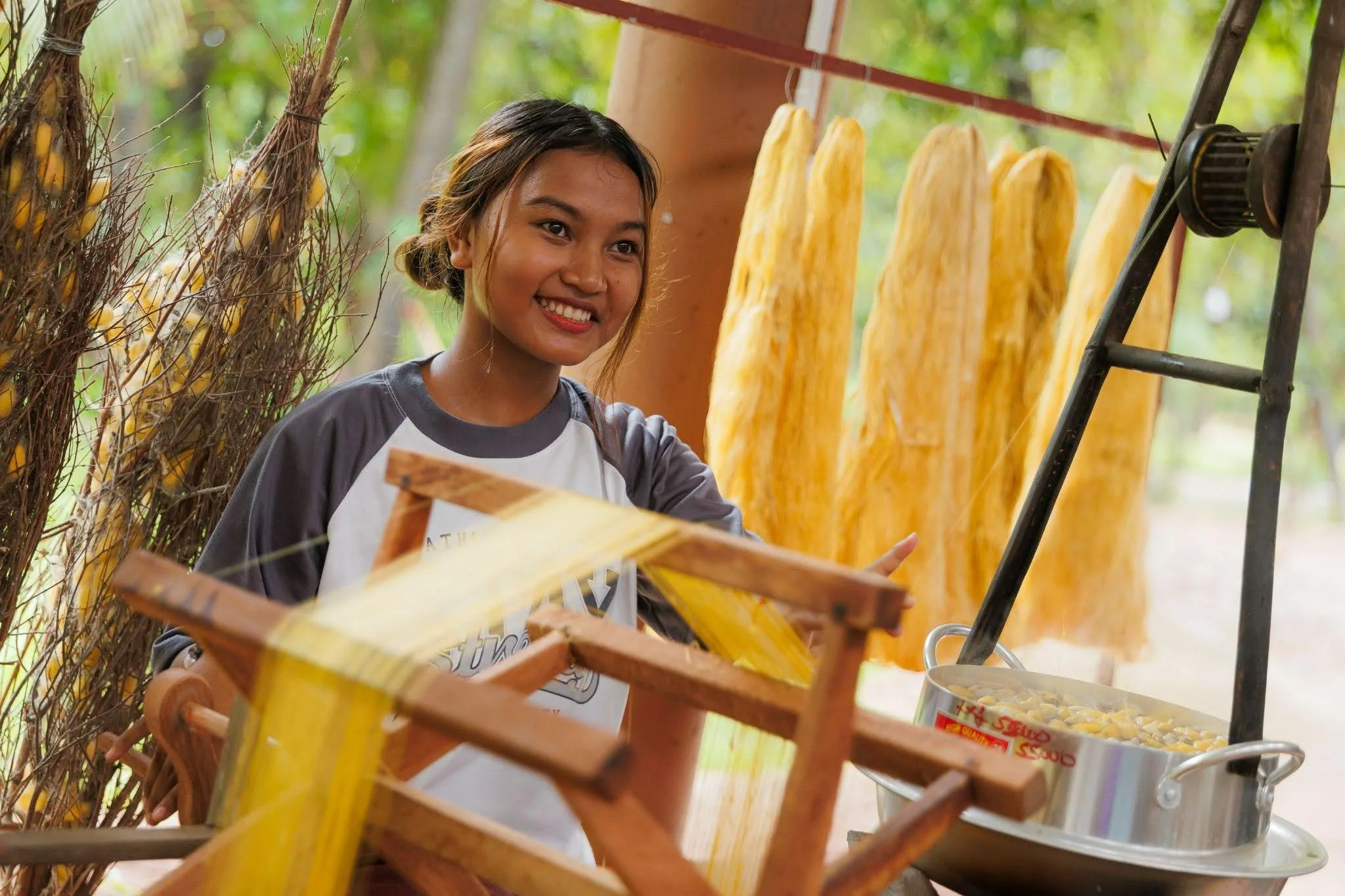A weaver at Silk Island.
