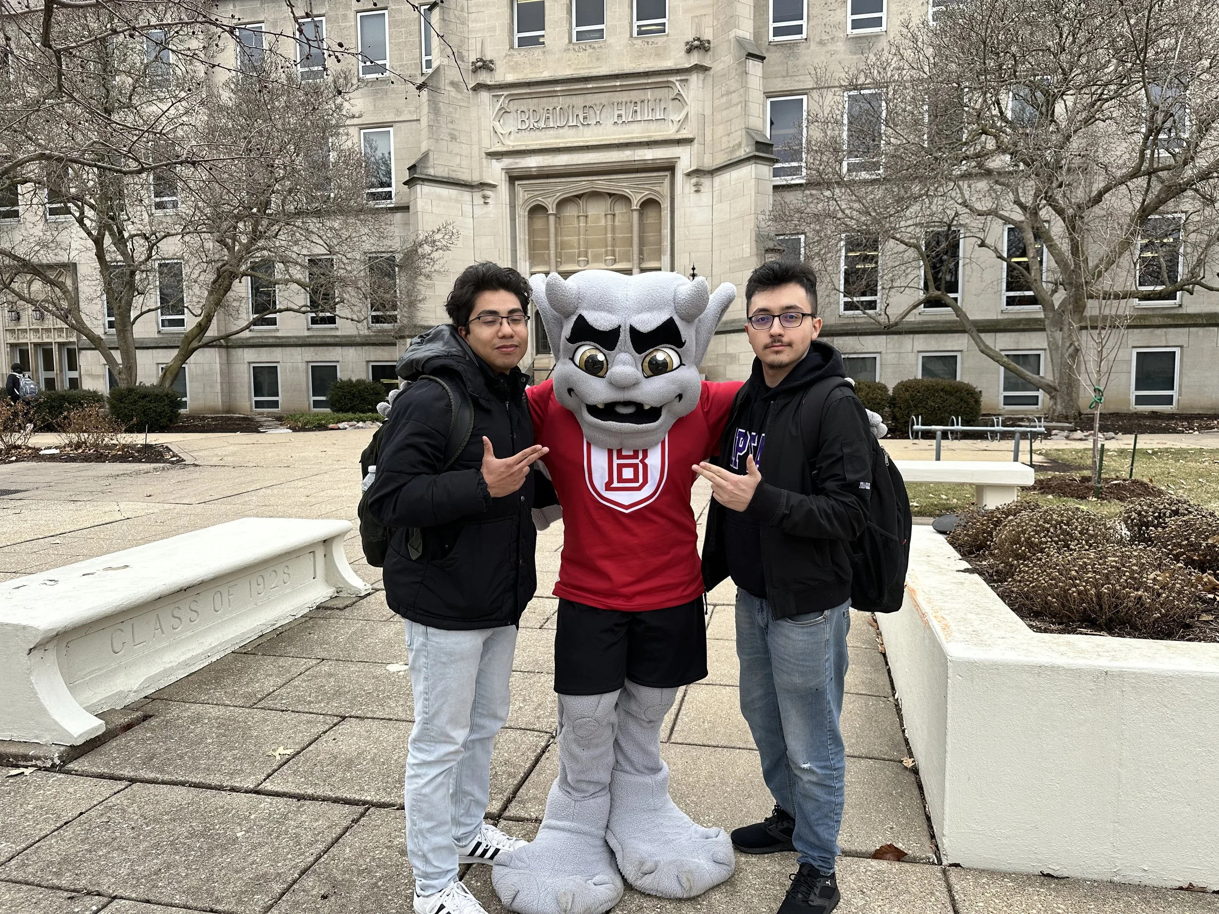 Bro. Jonathan (Left) & Bro. Osvaldo (Right) with Kaboom outside of Bradley Hall