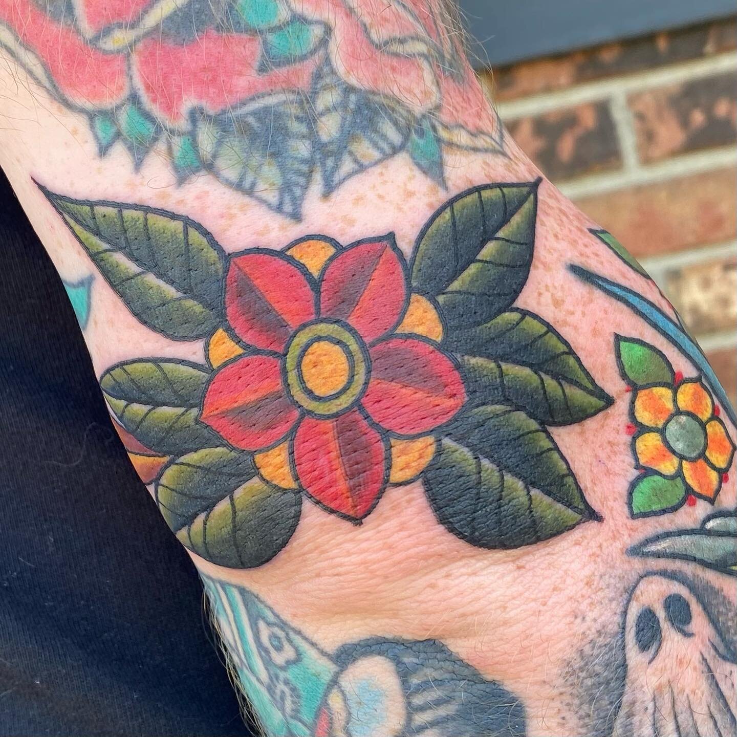 Traditional flower over the elbow filler. @snakeoiltattoo #tradionaltattoo #kentuckytattooartist