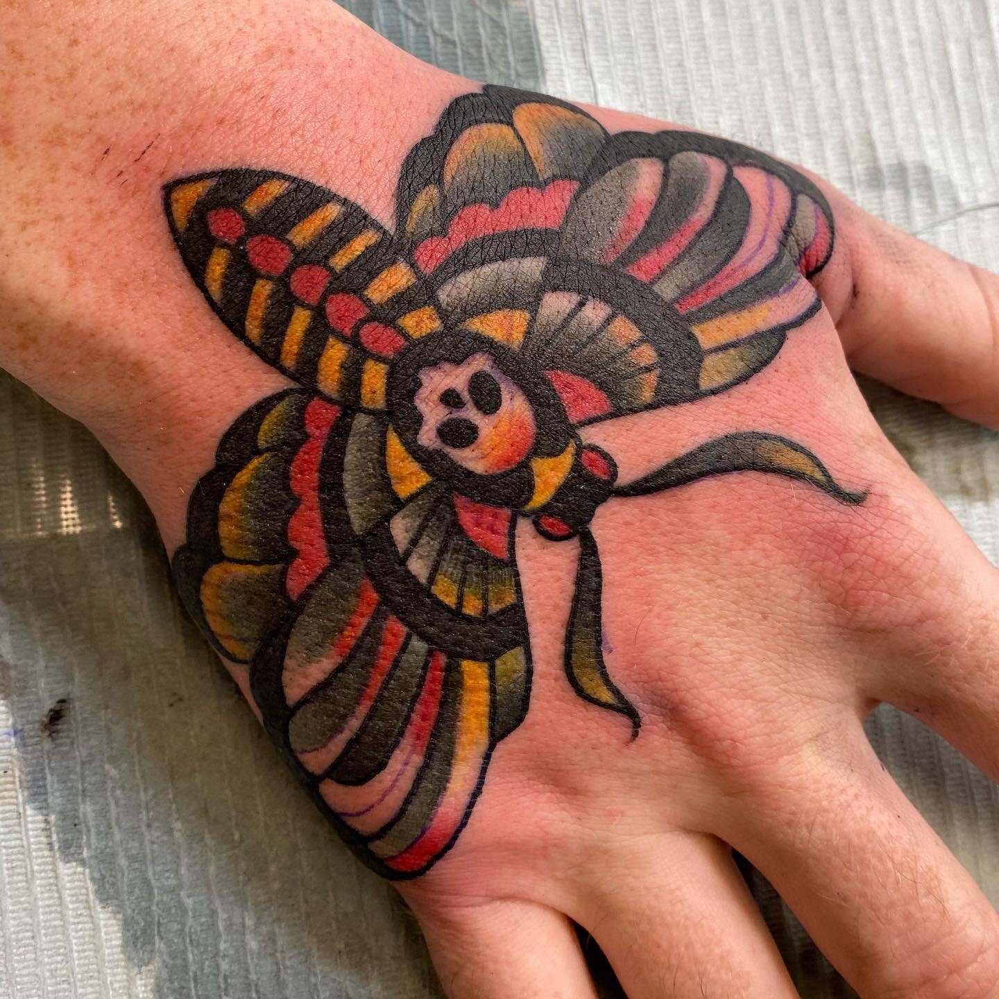 Angry ditch and hand! @randall_johnson you are tougher than most! @snakeoiltattoo #handtattoo #ditchtattoo #moth #nails #tradtattoos #kentuckytattooers