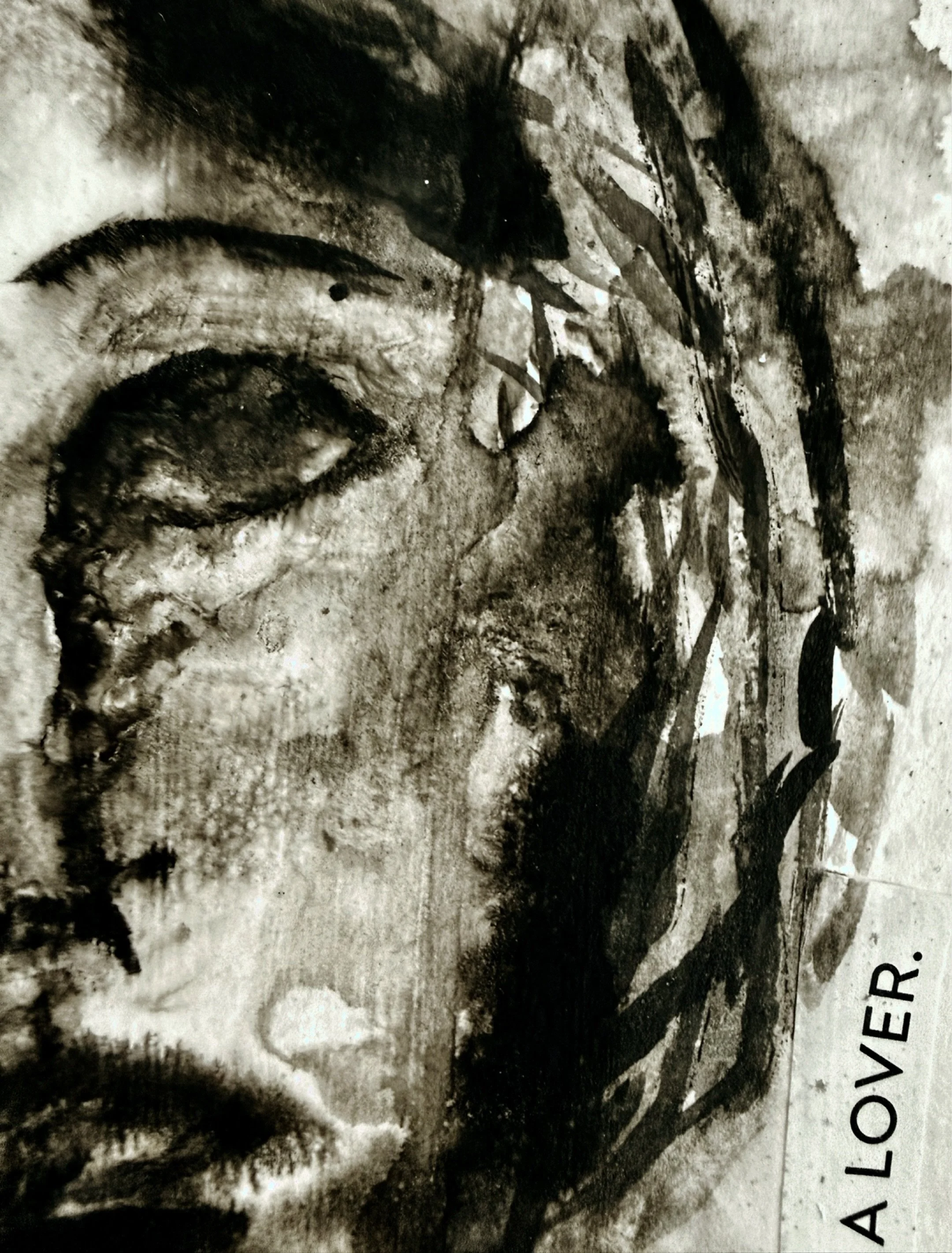 close up of a black and white mixed media artwork with abstract facial features and raw, gestural marks by Charlotte based artist Michel Van Devender.