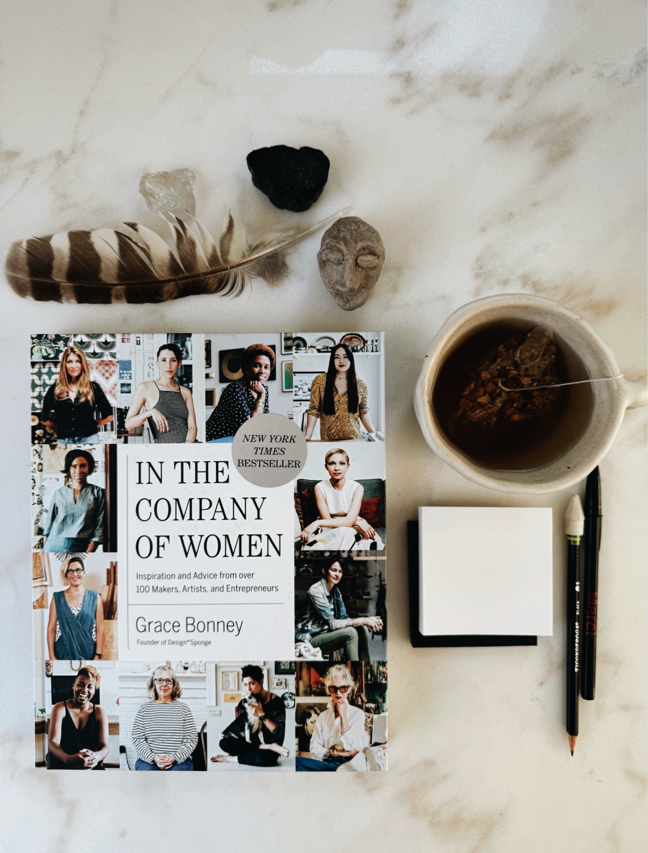 In the Company of Women by Grace Bonney inspirational book for artists and creatives on studio table.