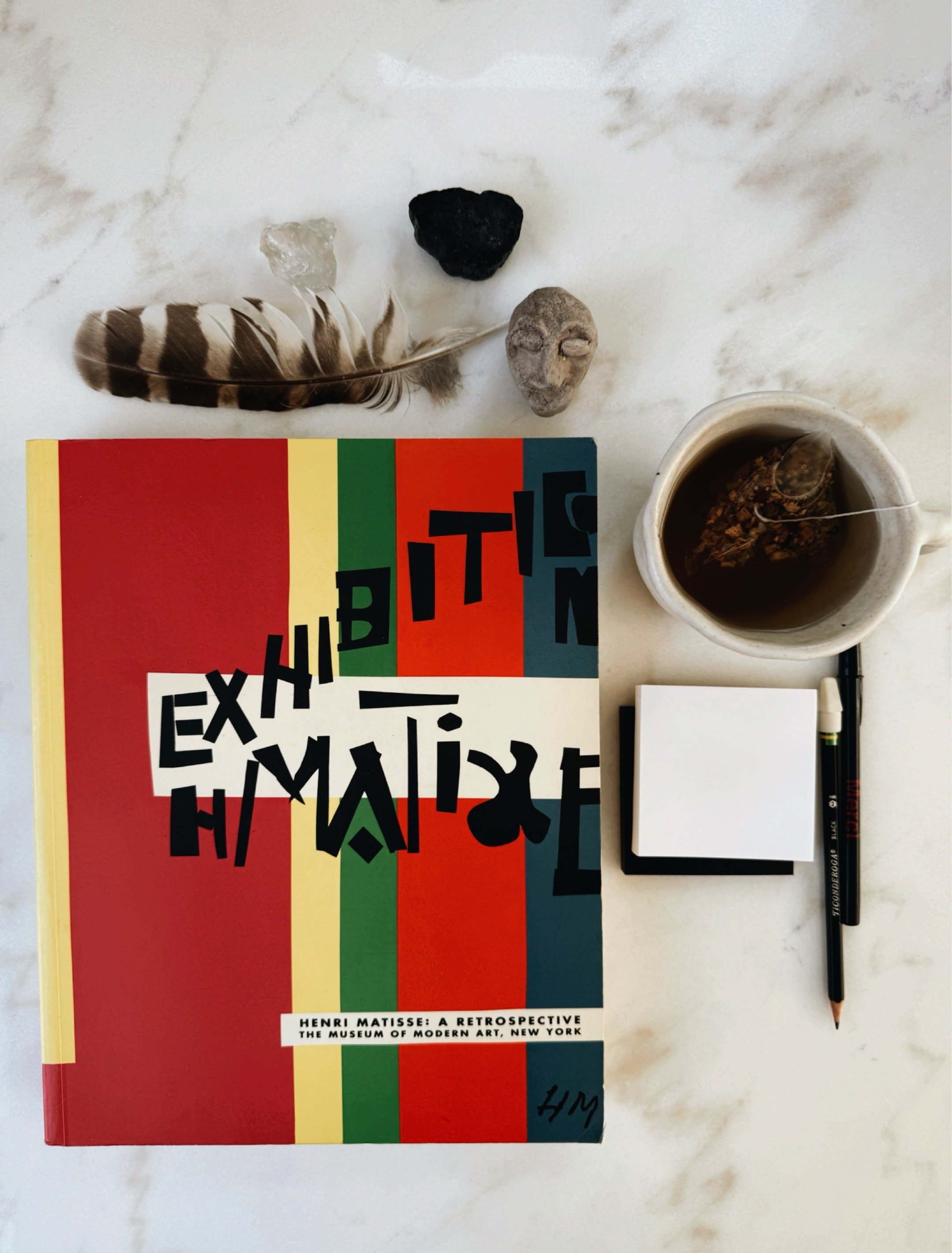 Henri Matisse: A Retrospective art book on studio table.